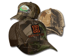 Group of camo colored, custom embroidered hunting caps